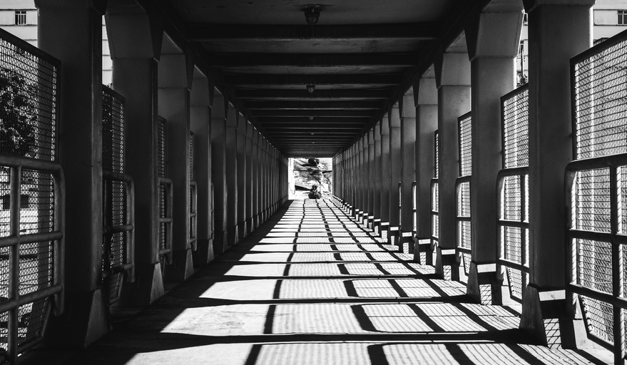 Black and White Photo of a Footbridge